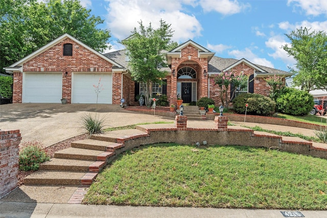 4215 Green Oak Dr, Waco, TX 76710 - traditional home with brick siding, concrete driveway, a front lawn, and an attached garage
