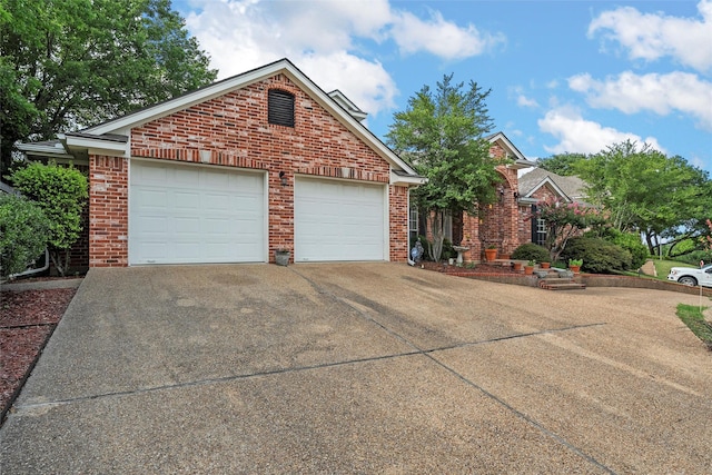 4215 Green Oak Dr, Waco, TX 76710 - view of front of house with concrete driveway and brick siding