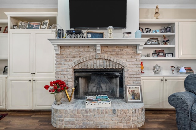 4215 Green Oak Dr, Waco, TX 76710 - detailed view of crown molding, wood finished floors, and a brick fireplace