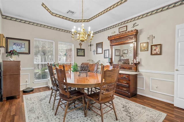 4215 Green Oak Dr, Waco, TX 76710 - dining space featuring a chandelier, ornamental molding, dark wood-style flooring, a raised ceiling, and baseboards