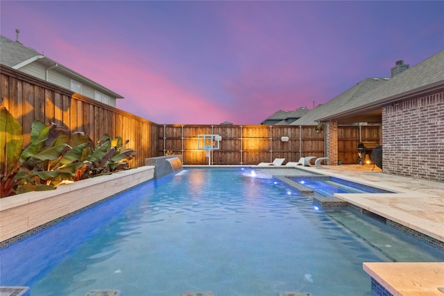 800 Marion Farm Rd E, Little Elm, TX 75068 - pool at dusk with a fenced backyard and a pool with connected hot tub