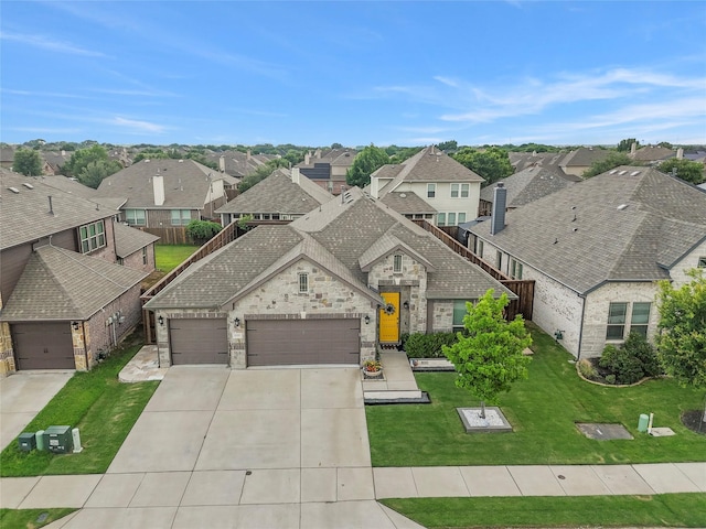 800 Marion Farm Rd E, Little Elm, TX 75068 - french provincial home featuring a residential view, stone siding, driveway, an attached garage, and a front lawn