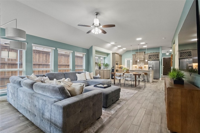 800 Marion Farm Rd E, Little Elm, TX 75068 - living area featuring lofted ceiling, light wood finished floors, and ceiling fan