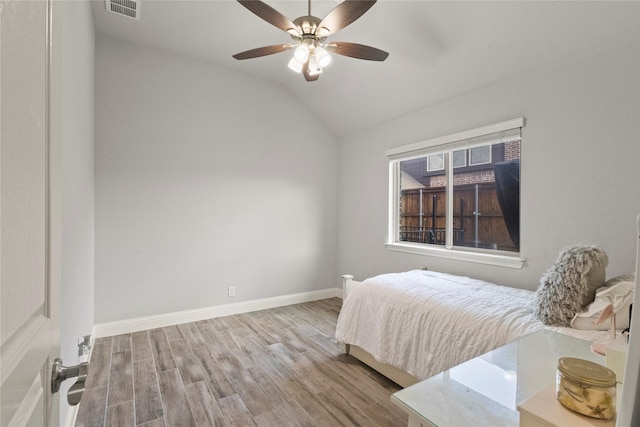 800 Marion Farm Rd E, Little Elm, TX 75068 - bedroom featuring wood finished floors, vaulted ceiling, baseboards, and a ceiling fan