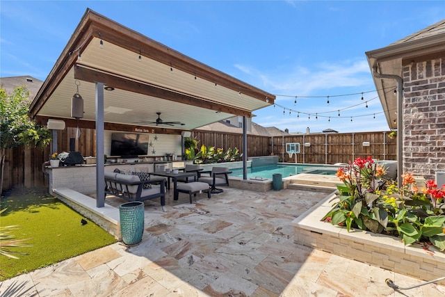 800 Marion Farm Rd E, Little Elm, TX 75068 - fenced backyard with a patio area, ceiling fan, exterior kitchen, and an outdoor living space