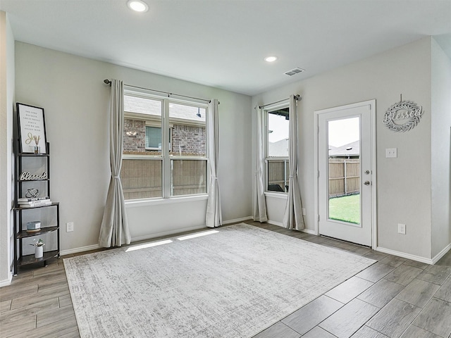 3019 Dakota Trl, Crandall, TX 75114 - empty room featuring wood finish floors, plenty of natural light, recessed lighting, and baseboards