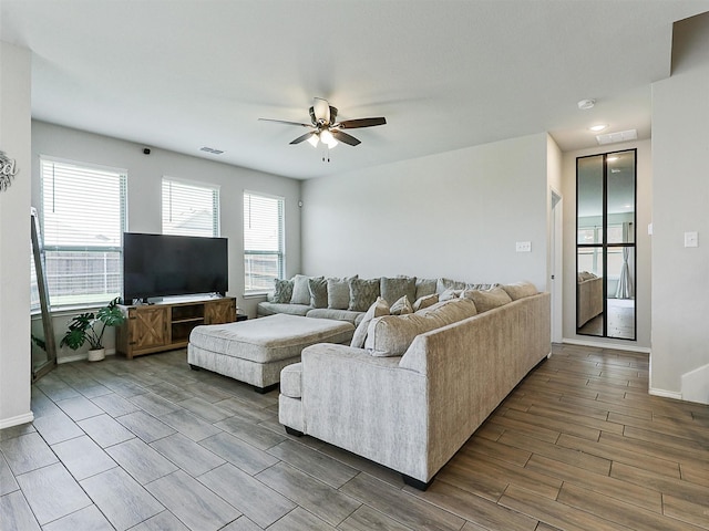 3019 Dakota Trl, Crandall, TX 75114 - living area featuring a ceiling fan, wood finished floors, and baseboards