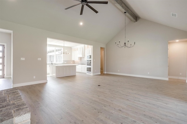 604 Bluff Point Ln, Haslet, TX 76052 - unfurnished living room with a chandelier, beam ceiling, a ceiling fan, light wood-type flooring, and high vaulted ceiling