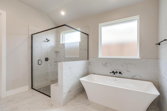 604 Bluff Point Ln, Haslet, TX 76052 - full bathroom with a freestanding bath, a stall shower, marble finish flooring, tile walls, and vaulted ceiling