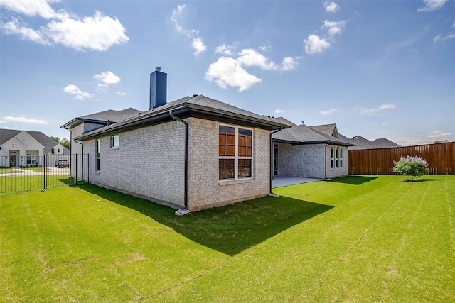 604 Bluff Point Ln, Haslet, TX 76052 - back of property with a chimney, brick siding, and a shingled roof