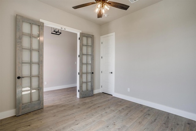 604 Bluff Point Ln, Haslet, TX 76052 - empty room featuring a ceiling fan, light wood-style flooring, french doors, and baseboards