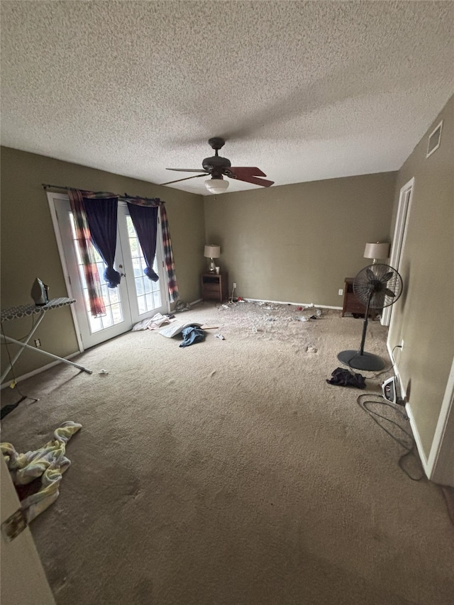 701 Rocky Canyon Rd, Arlington, TX 76012 - carpeted empty room with ceiling fan, a textured ceiling, and baseboards