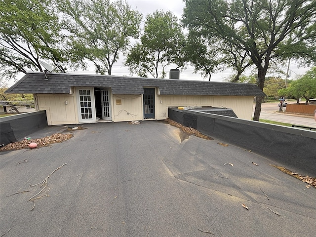 701 Rocky Canyon Rd, Arlington, TX 76012 - view of front of home with mansard roof and roof with shingles