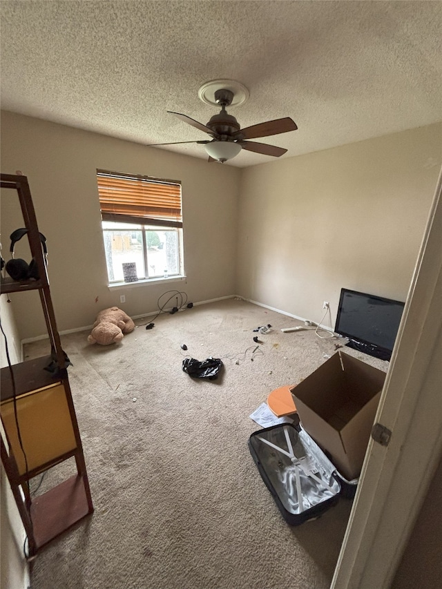 701 Rocky Canyon Rd, Arlington, TX 76012 - unfurnished bedroom featuring a textured ceiling, carpet flooring, baseboards, and ceiling fan