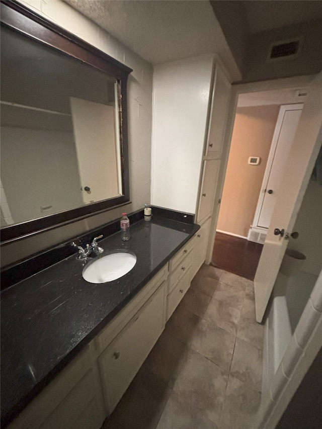 701 Rocky Canyon Rd, Arlington, TX 76012 - full bathroom with vanity and tile patterned flooring