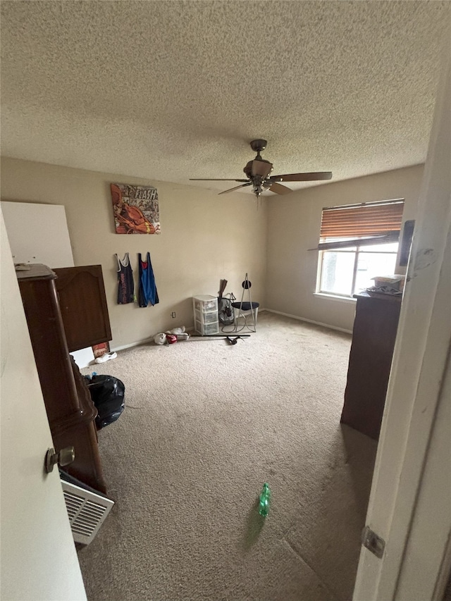 701 Rocky Canyon Rd, Arlington, TX 76012 - unfurnished bedroom with carpet, a textured ceiling, and ceiling fan