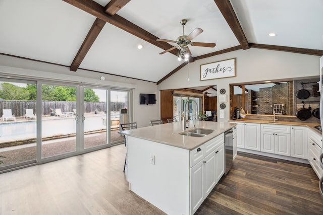108 Circleview Dr S, Hurst, TX 76054 - kitchen with a sink, wood finished floors, plenty of natural light, white cabinets, and recessed lighting