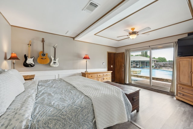 108 Circleview Dr S, Hurst, TX 76054 - bedroom featuring access to outside, wood finished floors, a ceiling fan, and wainscoting