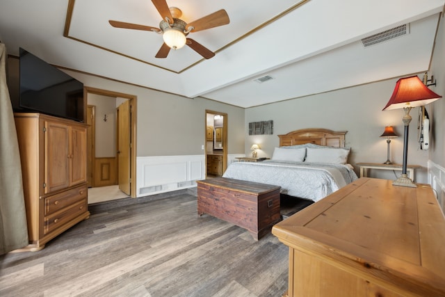 108 Circleview Dr S, Hurst, TX 76054 - bedroom featuring light wood-style flooring, a wainscoted wall, beamed ceiling, and a ceiling fan