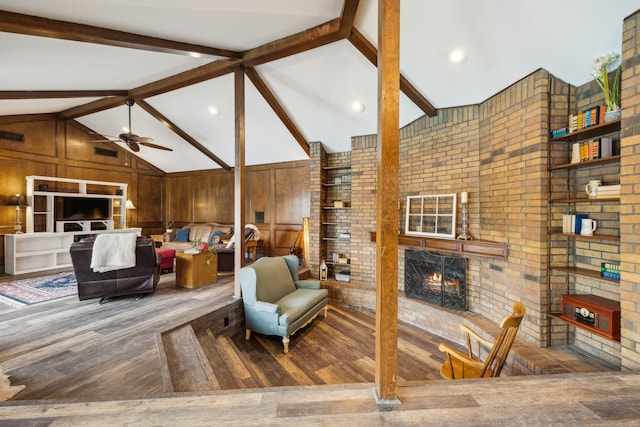 108 Circleview Dr S, Hurst, TX 76054 - living area with a brick fireplace, wood finished floors, ceiling fan, and brick wall