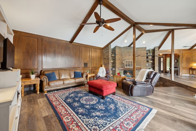 108 Circleview Dr S, Hurst, TX 76054 - living room with beamed ceiling, ceiling fan, wood finished floors, wooden walls, and high vaulted ceiling