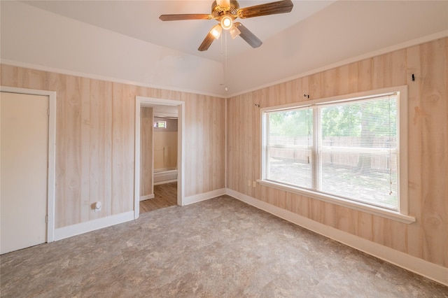101 S Walnut St, Petrolia, TX 76377 - carpeted spare room featuring a ceiling fan and wooden walls