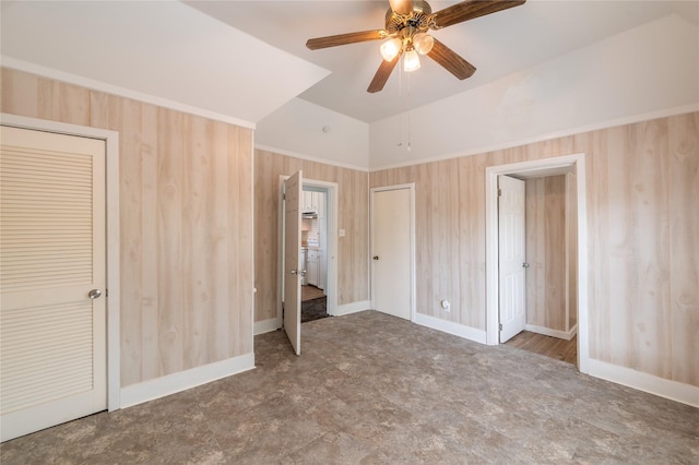 101 S Walnut St, Petrolia, TX 76377 - unfurnished bedroom with a ceiling fan, lofted ceiling, and baseboards