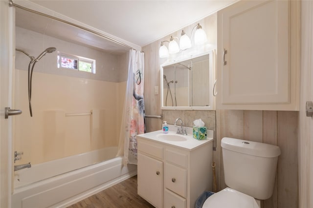 101 S Walnut St, Petrolia, TX 76377 - full bathroom featuring shower / bath combo with shower curtain, vanity, toilet, and wood finished floors