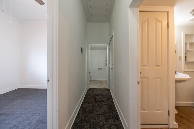 101 S Walnut St, Petrolia, TX 76377 - hall featuring attic access, dark colored carpet, and baseboards