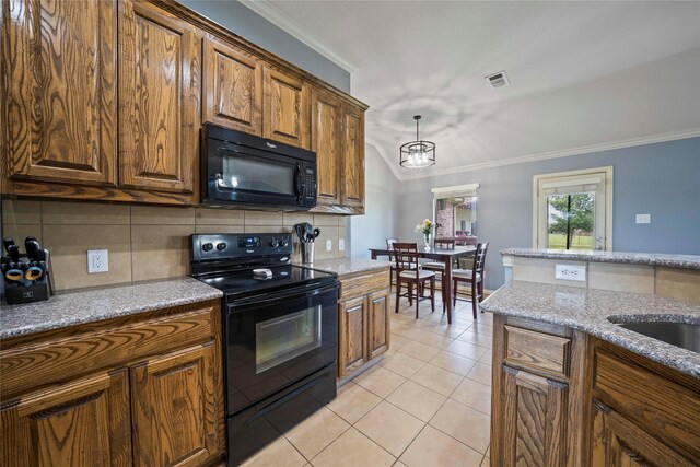 105 Universal Dr, Fate, TX 75189 - kitchen featuring black appliances, ornamental molding, backsplash, vaulted ceiling, and light tile patterned floors