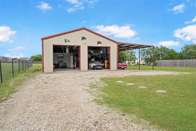 105 Universal Dr, Fate, TX 75189 - garage featuring dirt driveway and a garage