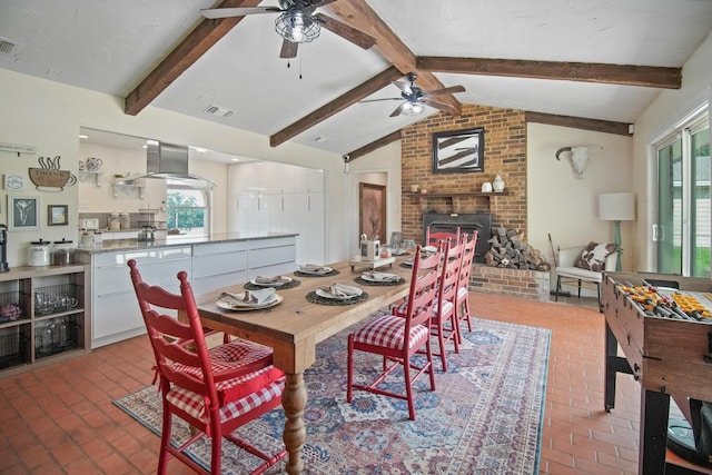 3044 US Highway 80, Grand Saline, TX 75140 - dining space featuring brick flooring, a ceiling fan, and a brick fireplace