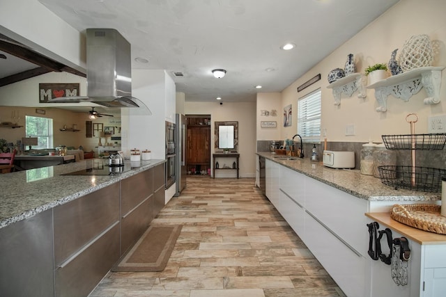 3044 US Highway 80, Grand Saline, TX 75140 - kitchen with black electric stovetop, a sink, modern cabinets, white cabinetry, and recessed lighting