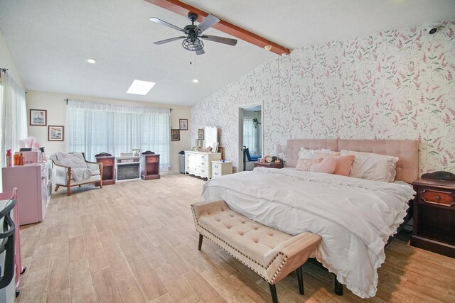 3044 US Highway 80, Grand Saline, TX 75140 - bedroom with wallpapered walls, light wood-type flooring, a ceiling fan, recessed lighting, and a skylight