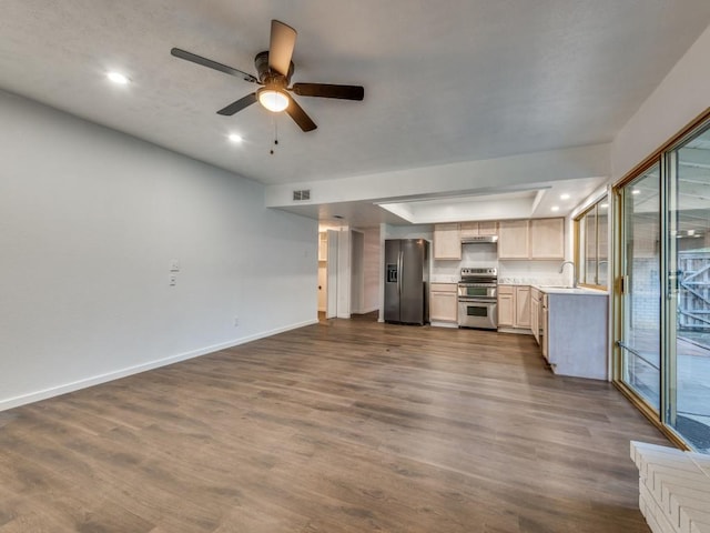 3101 Oak Hill Rd, Carrollton, TX 75007 - unfurnished living room with baseboards, recessed lighting, dark wood-type flooring, a ceiling fan, and a sink