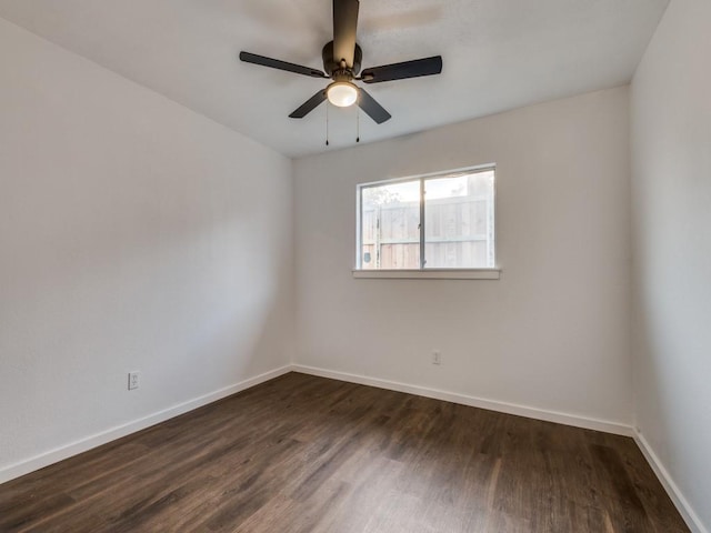 3101 Oak Hill Rd, Carrollton, TX 75007 - spare room featuring dark wood finished floors, baseboards, and ceiling fan