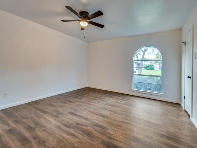 3101 Oak Hill Rd, Carrollton, TX 75007 - empty room with dark wood-type flooring, ceiling fan, and baseboards