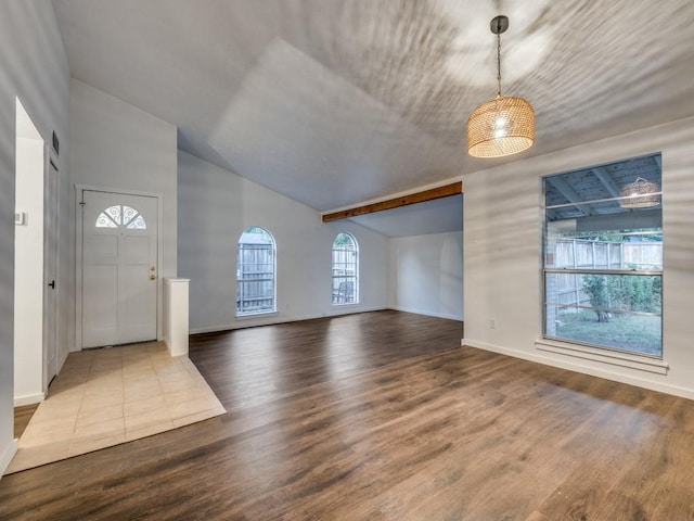 3101 Oak Hill Rd, Carrollton, TX 75007 - entryway with wood finished floors, baseboards, and high vaulted ceiling