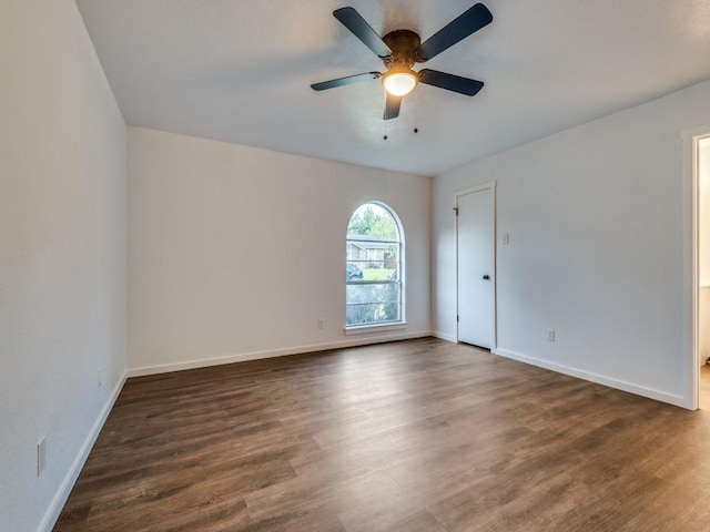 3101 Oak Hill Rd, Carrollton, TX 75007 - spare room with ceiling fan, dark wood-style floors, and baseboards