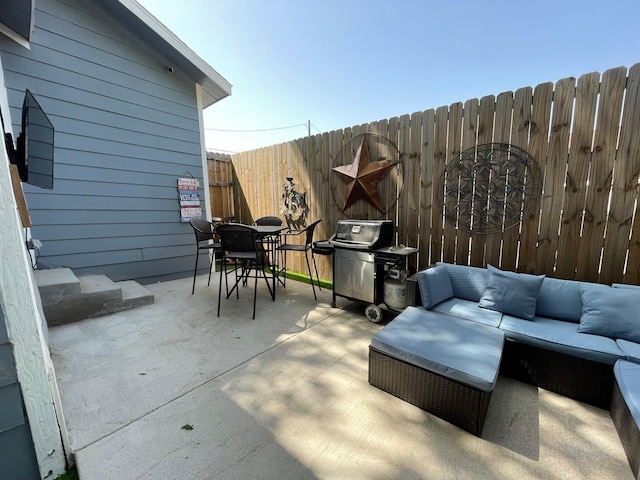 702 N Tennessee St, Mckinney, TX 75069 - fenced backyard with an outdoor living space, outdoor dining space, a patio, and a grill