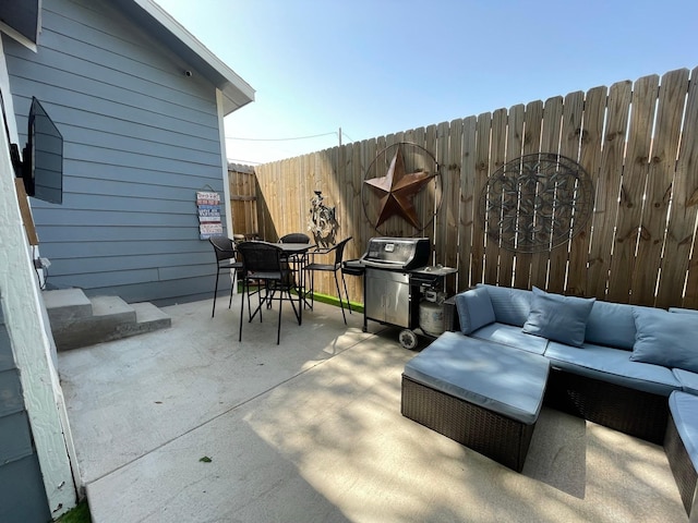 702 N Tennessee St, Mckinney, TX 75069 - fenced backyard featuring an outdoor hangout area, outdoor dining space, a patio area, and grilling area