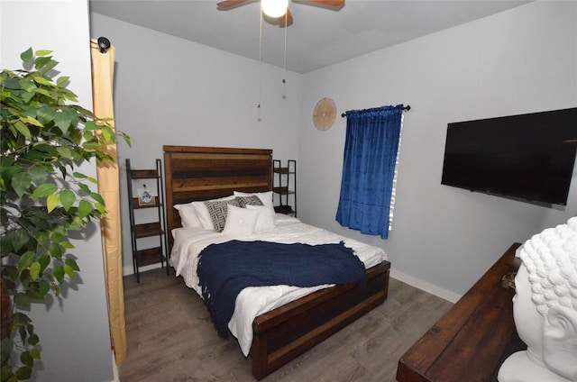 702 N Tennessee St, Mckinney, TX 75069 - bedroom with wood finished floors, ceiling fan, and baseboards