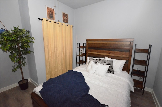 702 N Tennessee St, Mckinney, TX 75069 - bedroom with wood finished floors and baseboards