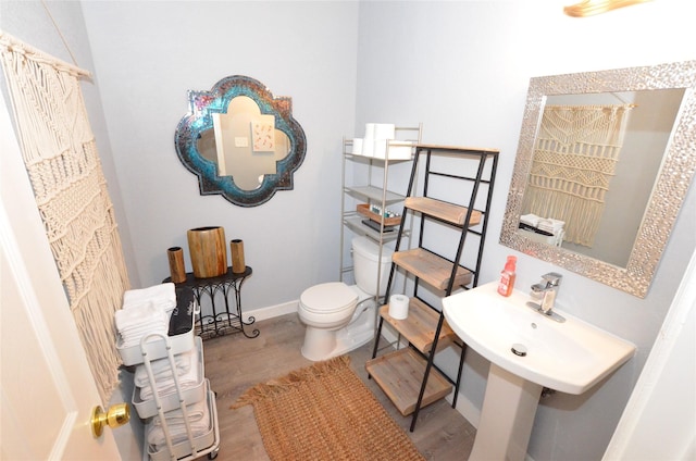 702 N Tennessee St, Mckinney, TX 75069 - full bath with toilet, wood finished floors, and baseboards