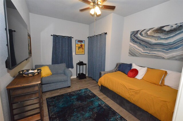 702 N Tennessee St, Mckinney, TX 75069 - bedroom featuring wood finished floors and ceiling fan