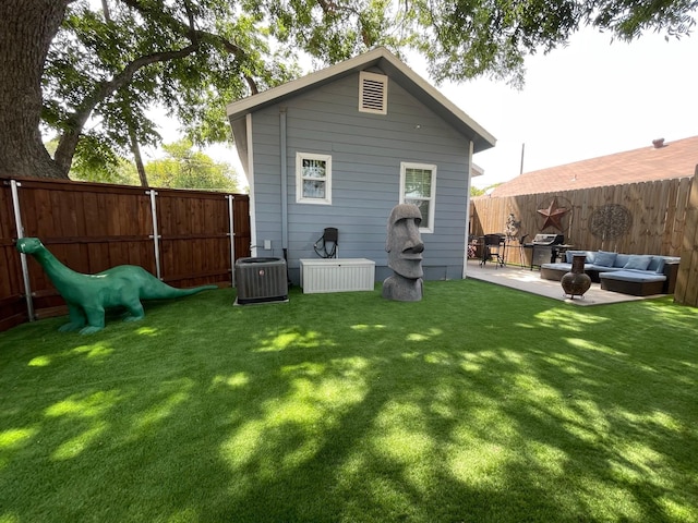 702 N Tennessee St, Mckinney, TX 75069 - back of house featuring a patio area, central air condition unit, and an outdoor living space