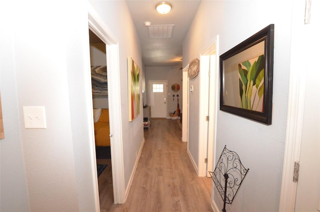 702 N Tennessee St, Mckinney, TX 75069 - hallway featuring light wood-style flooring and baseboards
