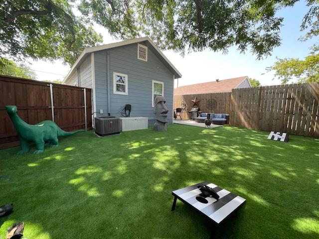702 N Tennessee St, Mckinney, TX 75069 - rear view of house with central AC and an outdoor hangout area