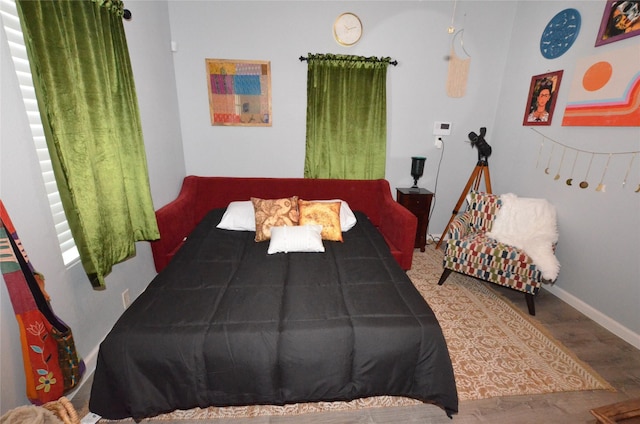 702 N Tennessee St, Mckinney, TX 75069 - bedroom featuring wood finished floors and baseboards