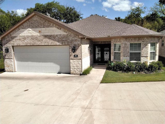 901 E Jefferson St, Van Alstyne, TX 75495 - view of front of property with brick siding, concrete driveway, a shingled roof, and a garage